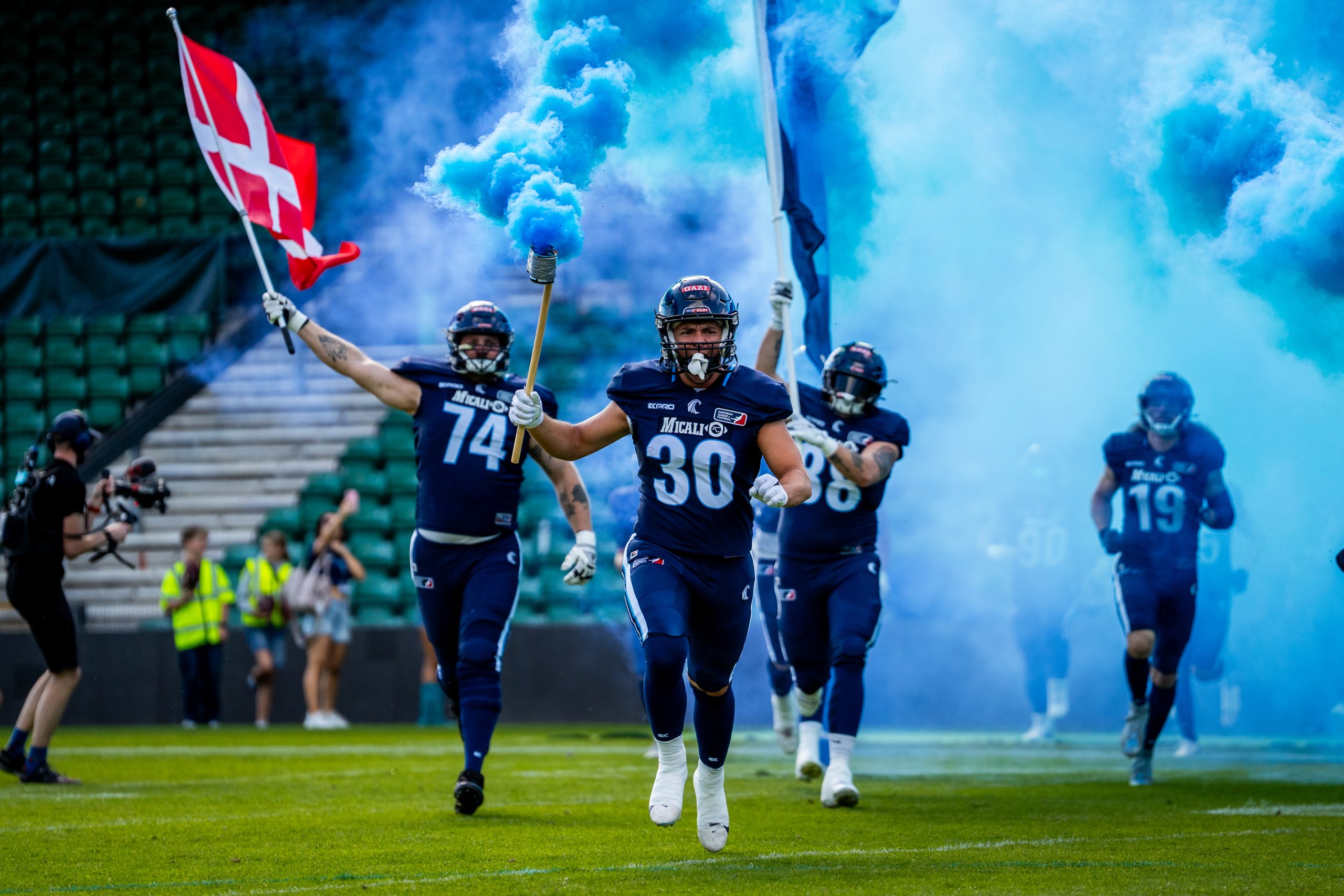 Players entering the football field